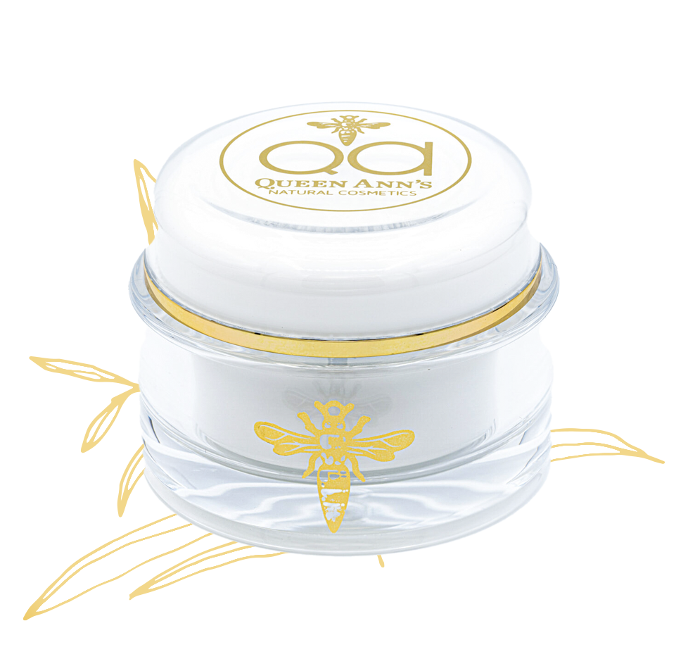 A white jar with gold bee on it.